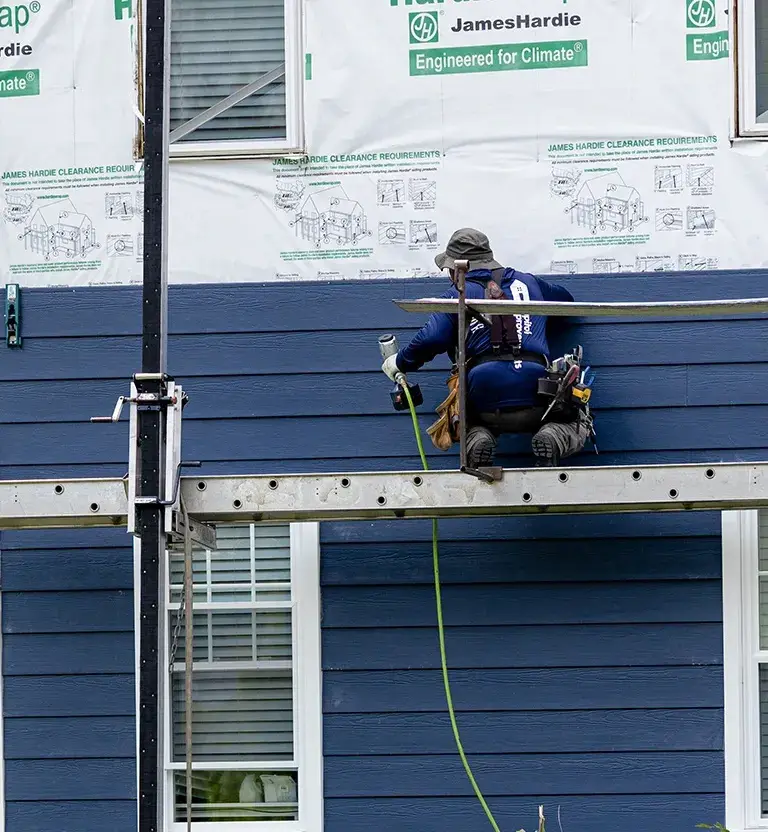 Install process of the Capital Improvements employees installing James Hardie siding.