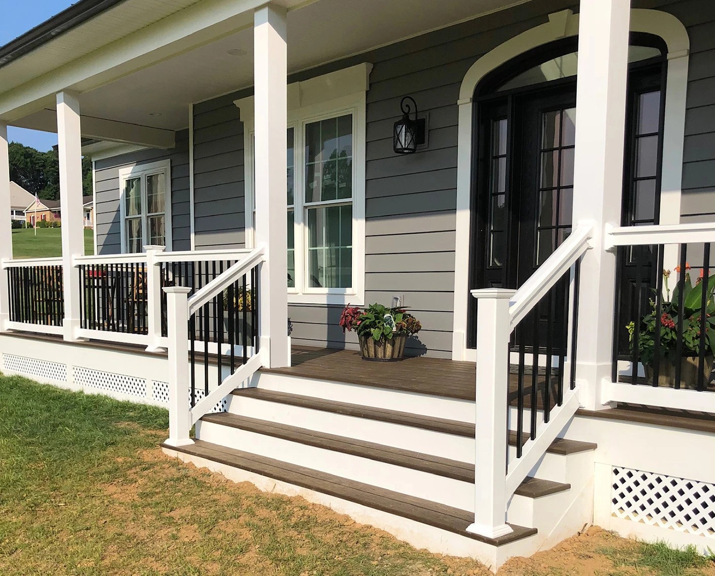 A welcoming front porch with composite decking boards. 