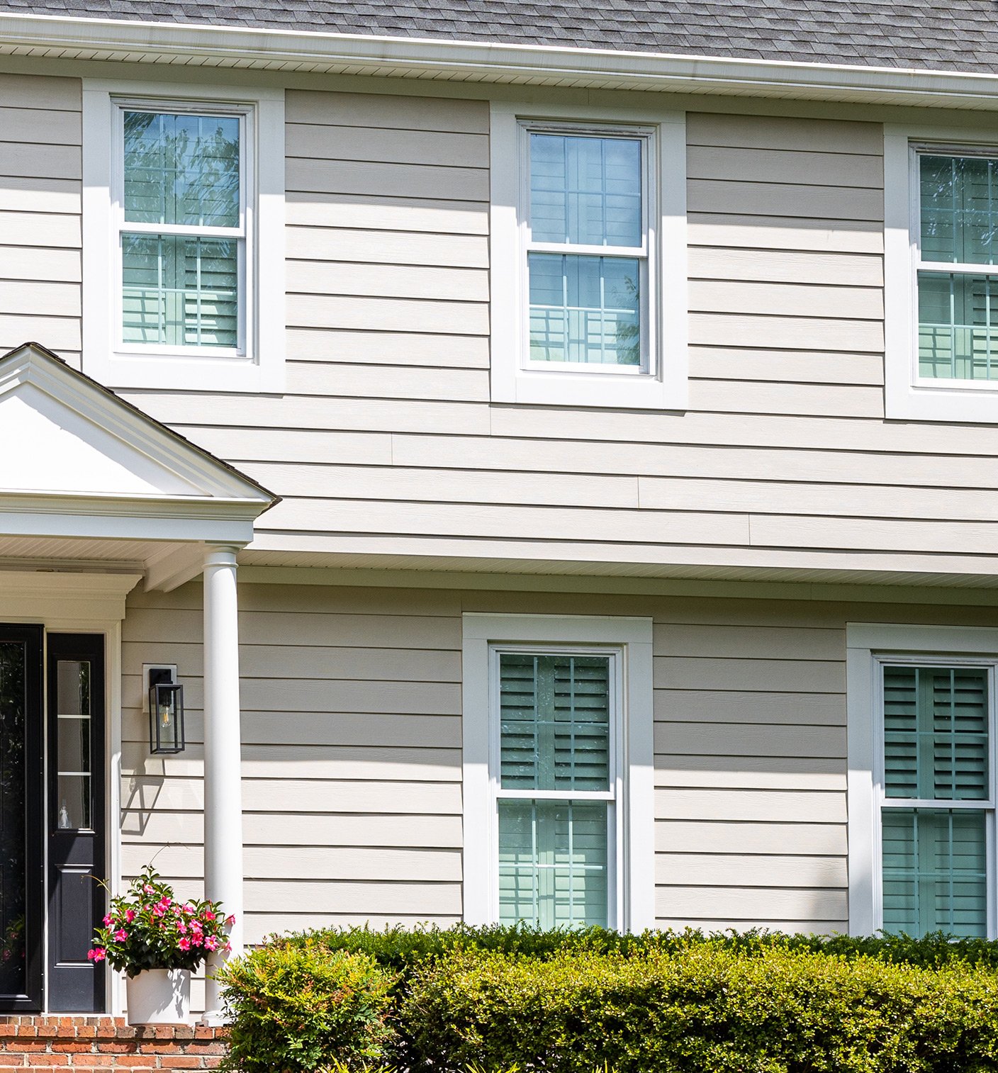 Vinyl siding and vinyl windows. 