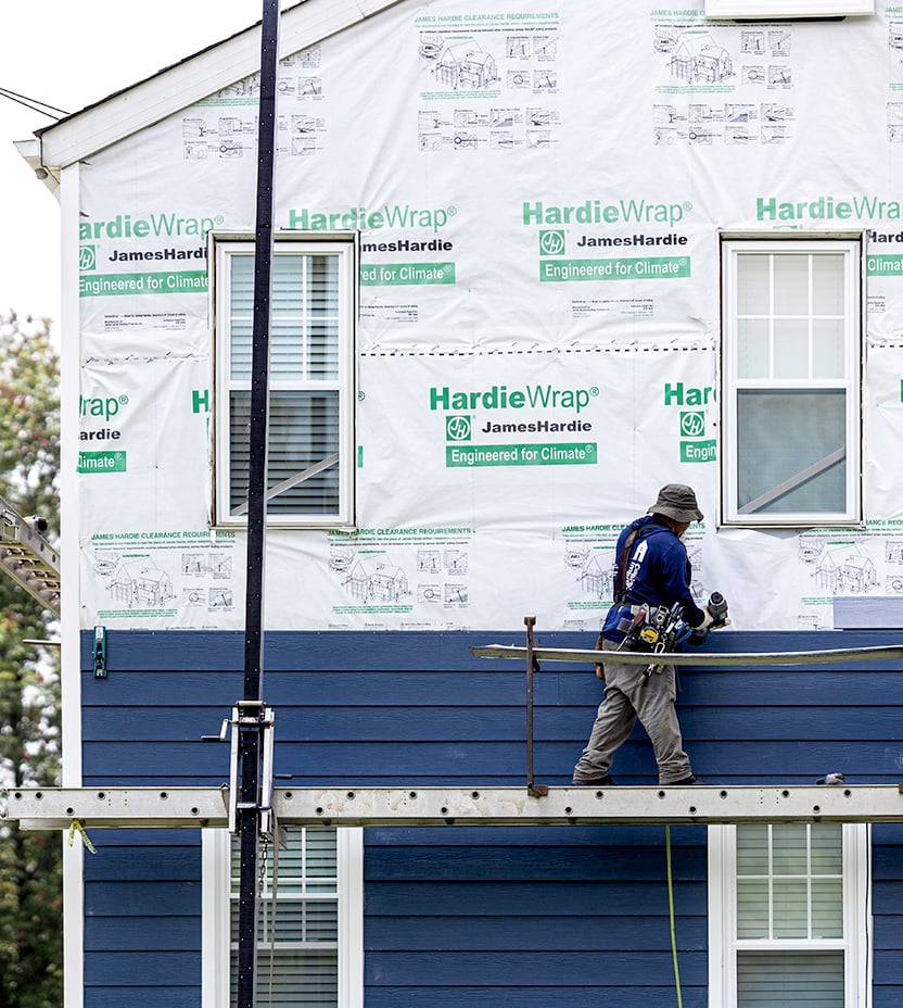 Installation of James Hardie siding. 