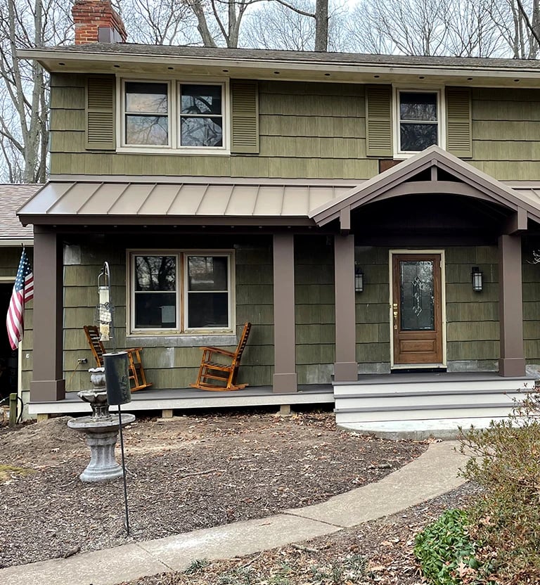 A almond color standing seam metal roof installed in Frederick, MD.