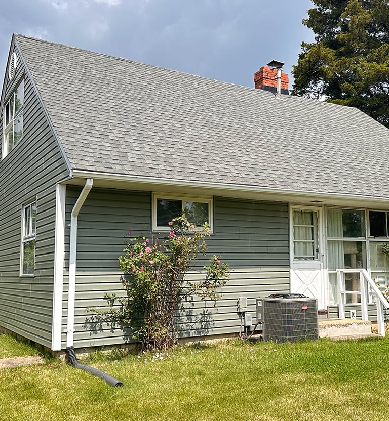 Sage green vinyl siding.