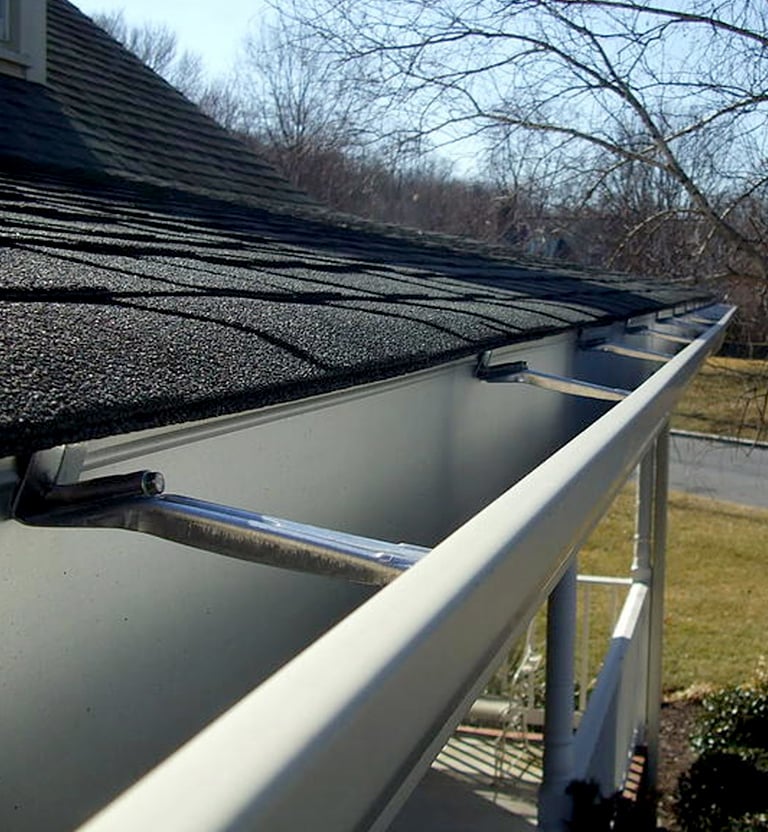 Seamless gutters with hidden structural brackets. 