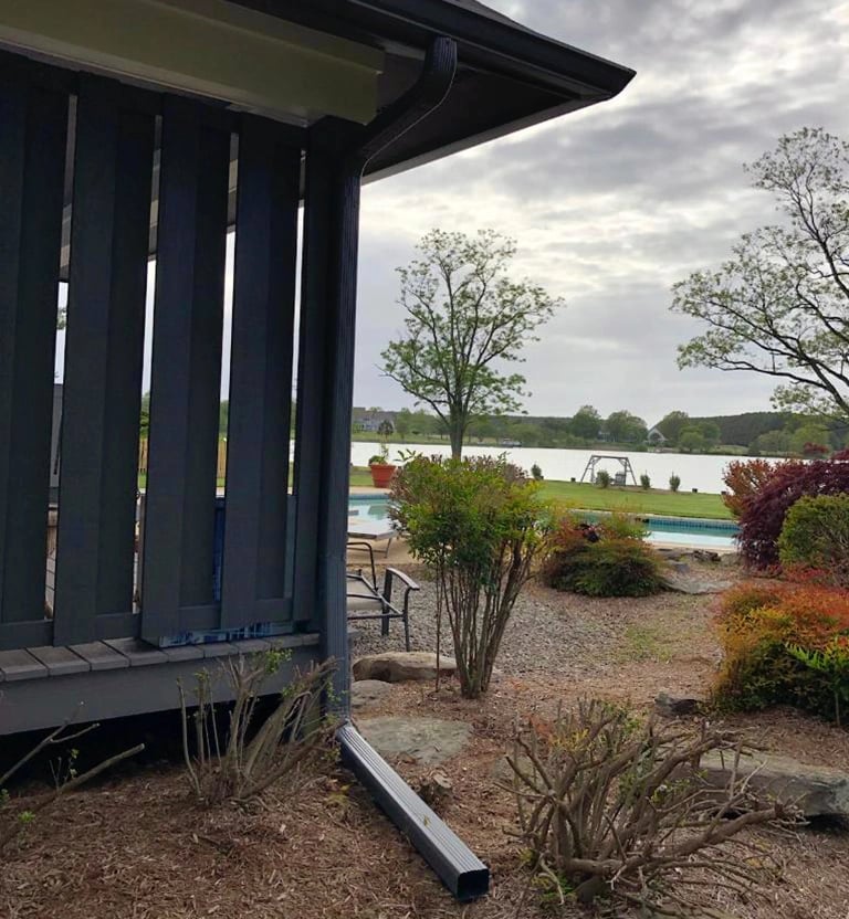 Black gutters and downspouts in Stevensville, MD. 