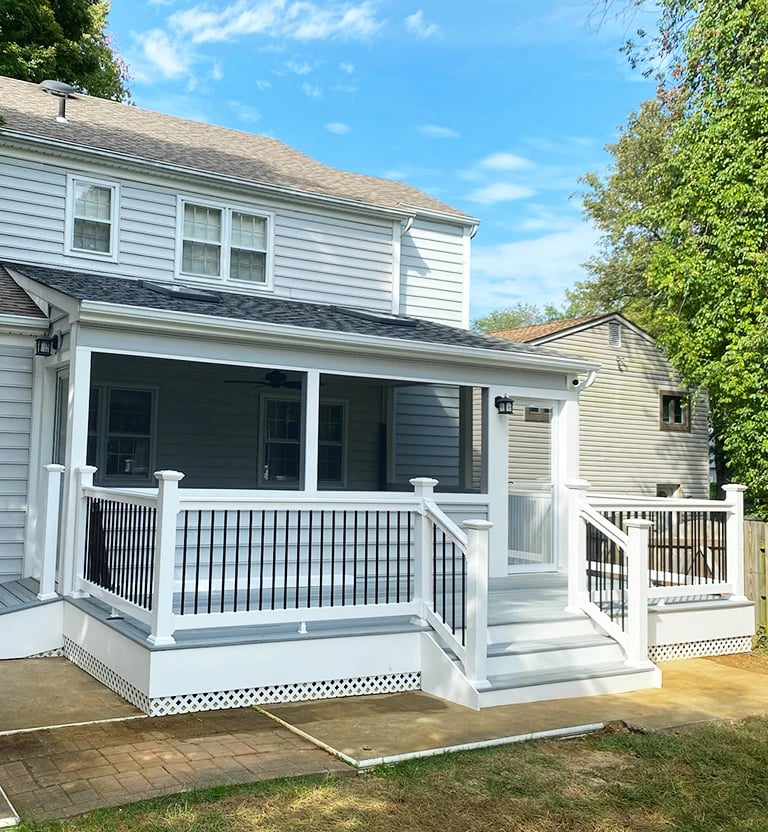 A screened in porch with composite decking in Bowie, MD.