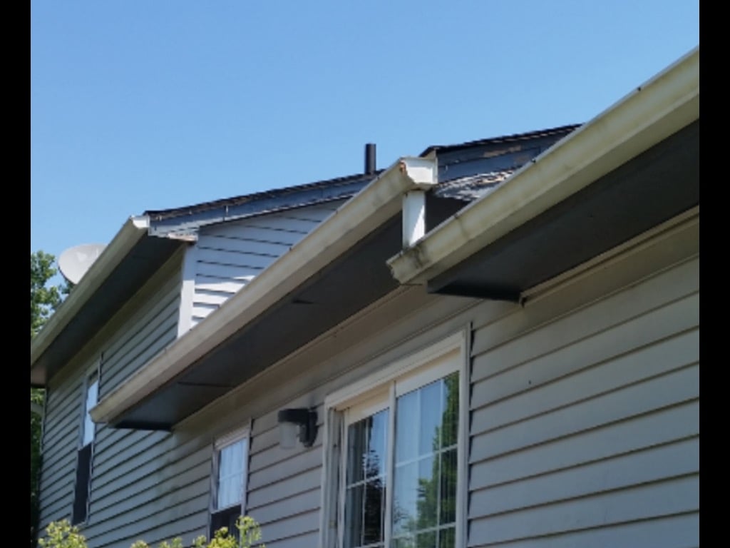 Exterior Trim Damage Repairs Needed on a house with damage from woodpeckers damaging the house. 