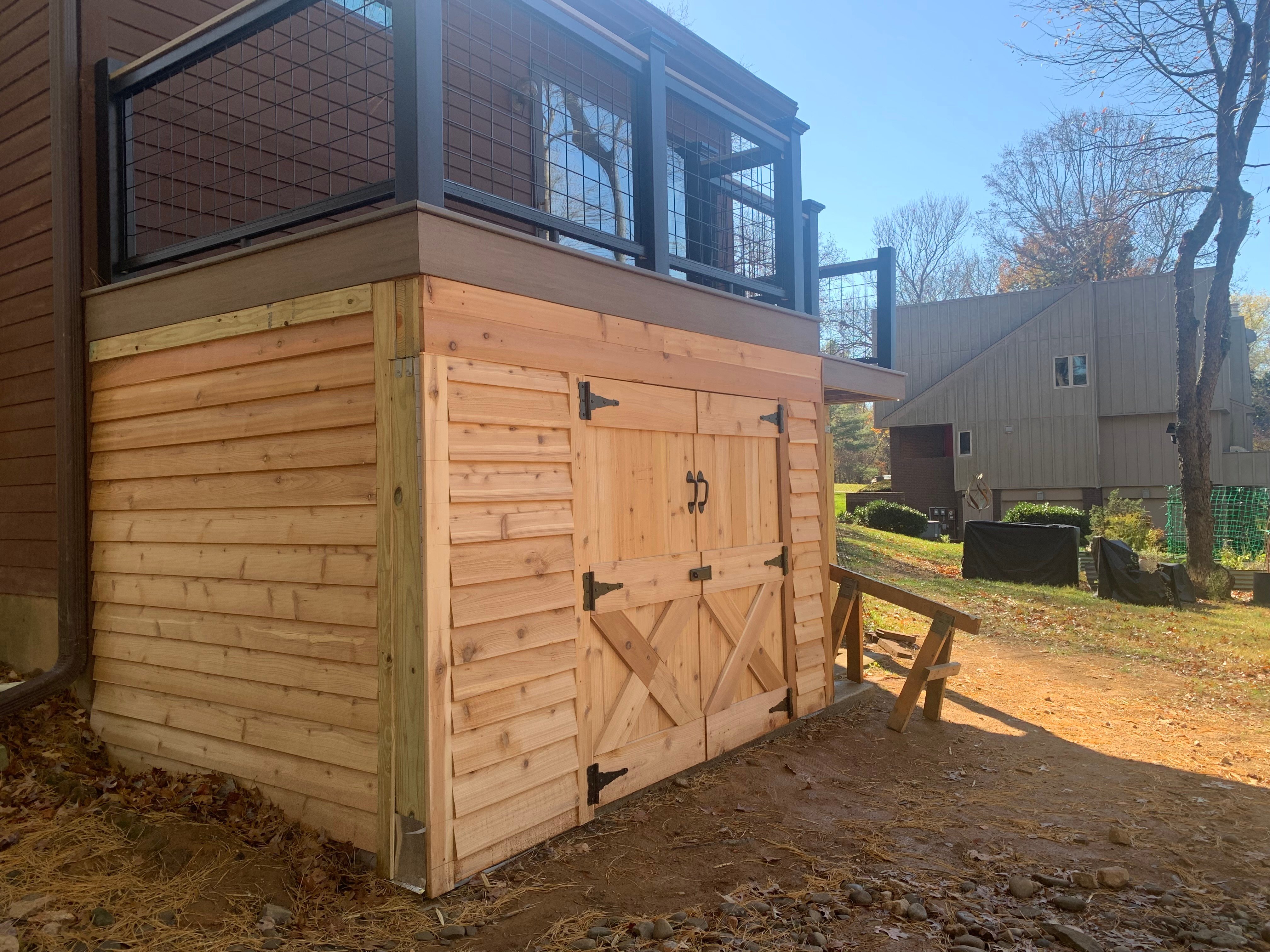 Deck with custom built under-deck storage. 