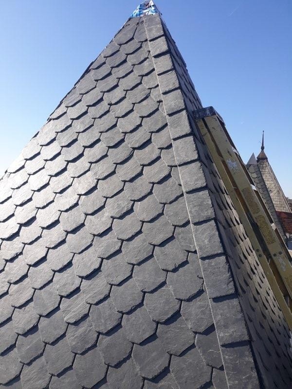 Hand-cut natural slate scallops on a historic DC turret